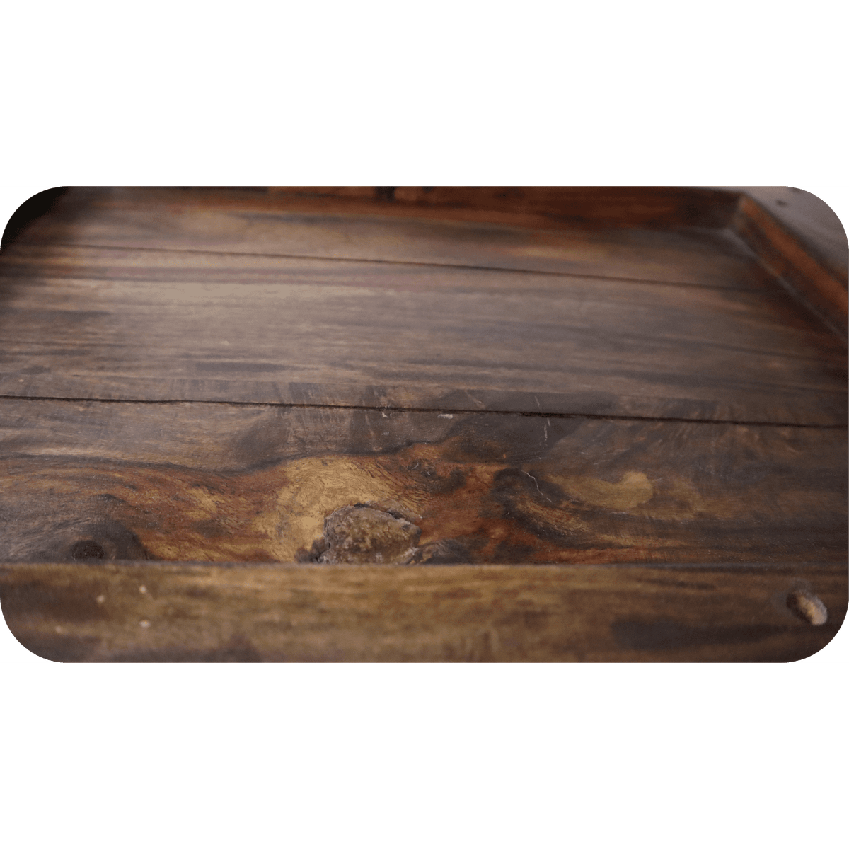Close-up of the eco-friendly Rosewood Console surface with visible grains and knots, featuring a slightly glossy finish. The wood exhibits natural color variations from light to dark brown, creating an earthy texture ideal for dining room furniture.