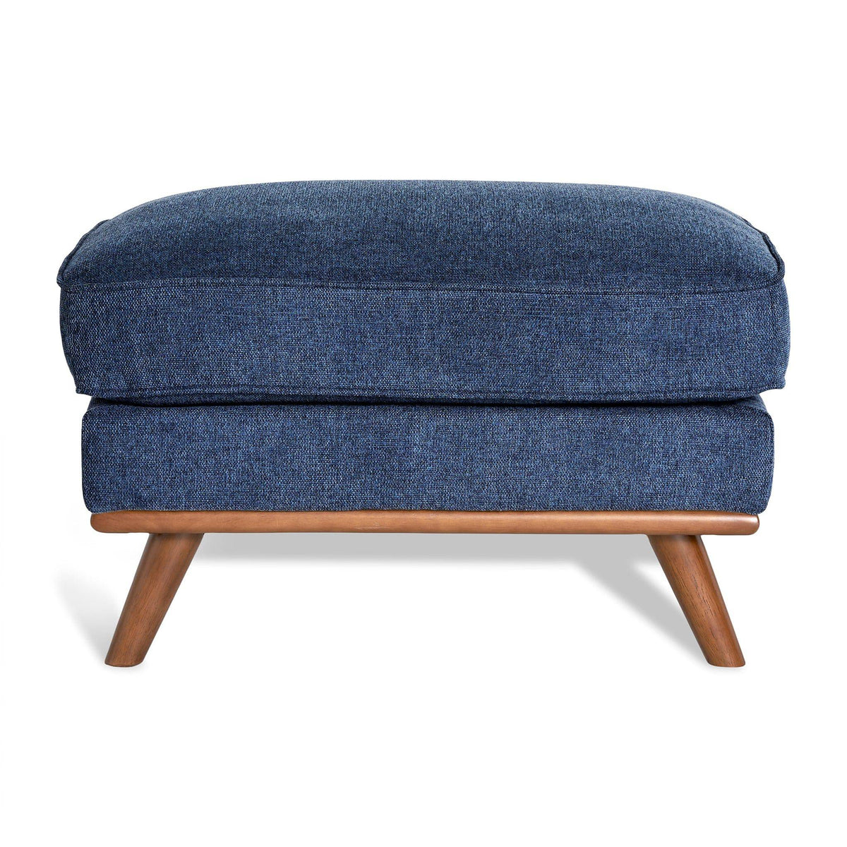 The Maddox Ottoman features textured blue upholstery and a rectangular cushion. Its mid-century design includes a wooden frame with four angled legs in a natural finish, making it an elegant addition to any living space.