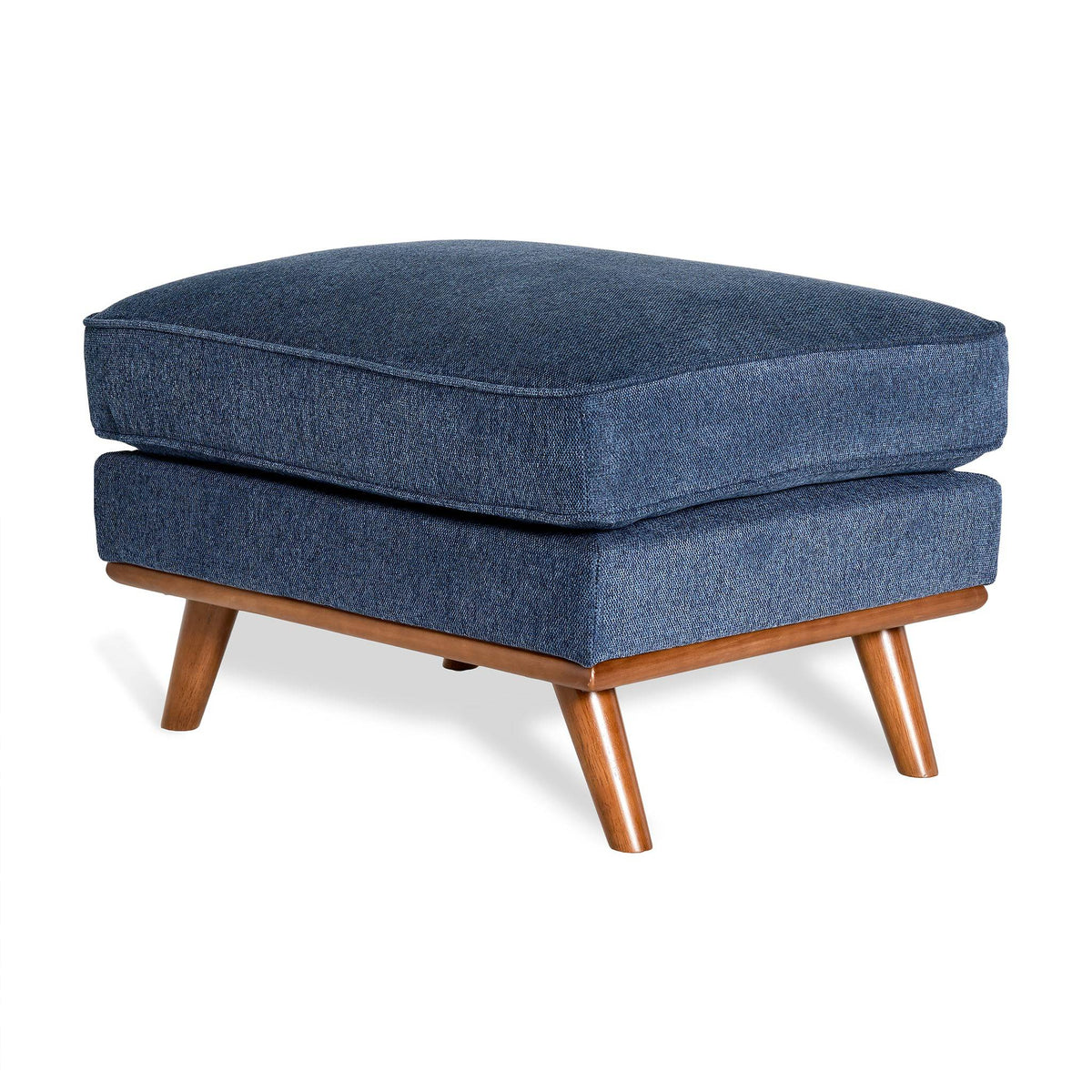 The Maddox Ottoman enhances any living space with its mid-century modern design, featuring a plush blue square cushion on four tapered wooden legs in a natural finish.