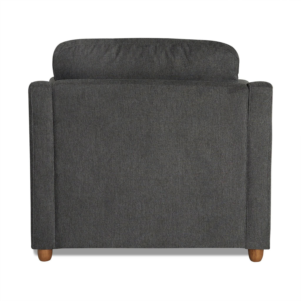 Back view of the My Cloud Slope Chair, a dark gray upholstered armchair with a cushioned backrest for customizable comfort and wooden legs, set against a plain white background.