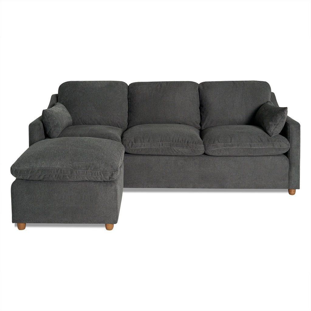 The My Cloud Slope Sofa is a dark gray L-shaped sectional with three cushions, a left chaise, wooden legs, and matching armrest cushions. It features machine-washable covers and offers a modern, plush appearance.