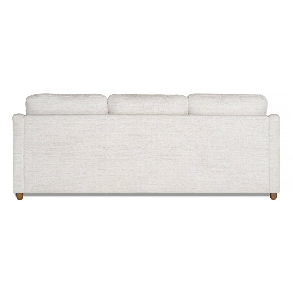 The My Cloud Slope Sofas back view features three cushions, wooden legs, and a modern off-white design. Its covers are machine-washable, set against a plain white background for an elegant look.