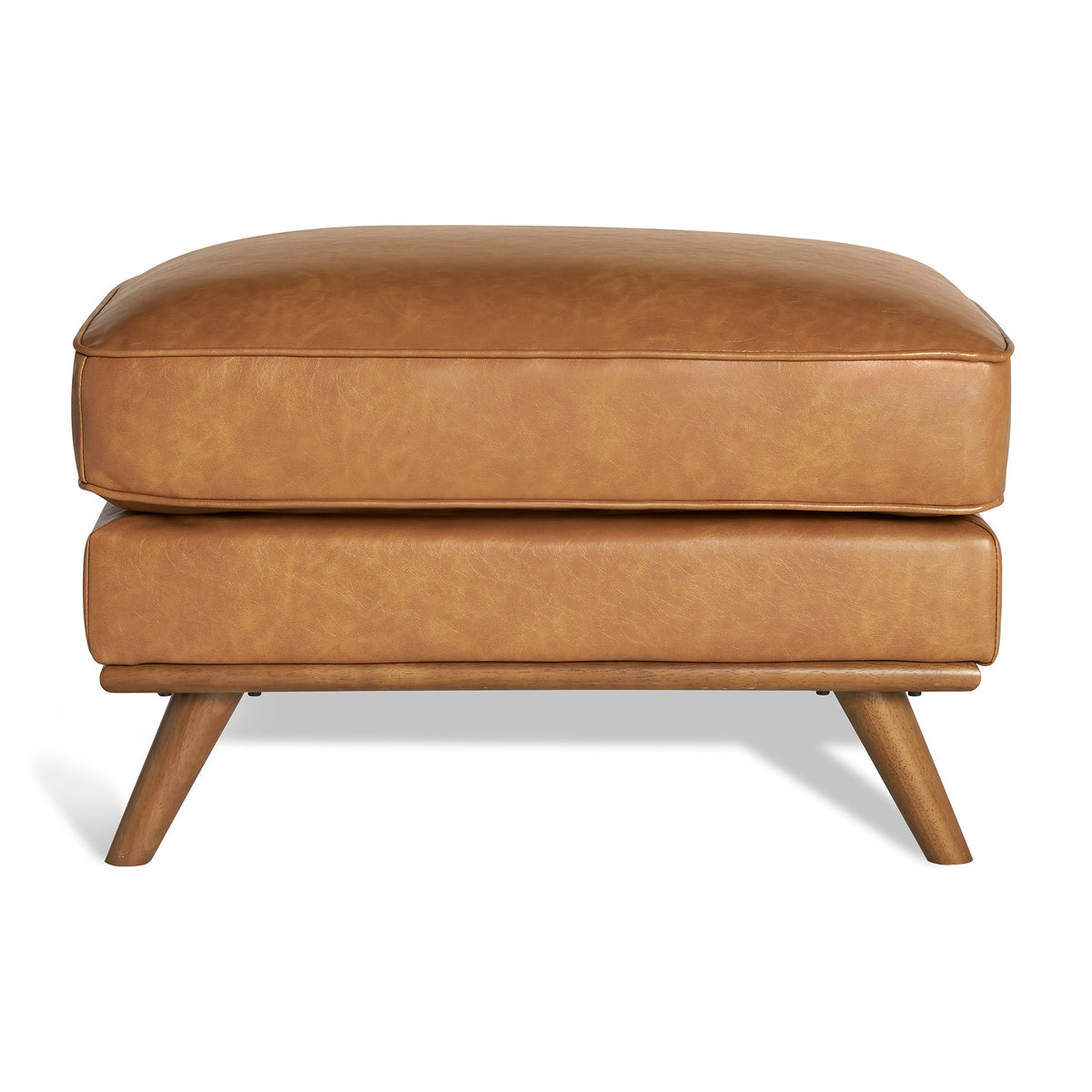 Meet the Maddox Ottoman: a rectangular brown leather piece with four angled wooden legs, complemented by a plush cushion. This cozy yet stylish ottoman adds mid-century modern charm to any living area against a simple white background.