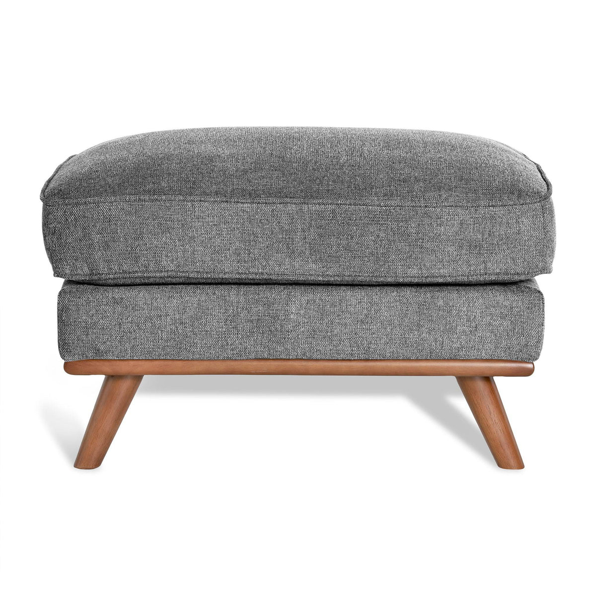 The Maddox Ottoman has a gray upholstered rectangular cushion with subtly textured fabric, supported by four angled wooden legs, adding mid-century charm to any living space.