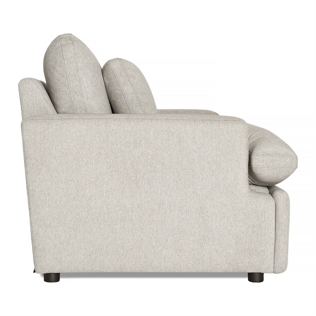 Side view of the My Cloud Power Recliner in light gray, featuring thick cushions and a low backrest. This modern piece of comfortable furniture is supported by short black legs, with soft, textured fabric for an inviting feel—perfect for relaxation in any living space.