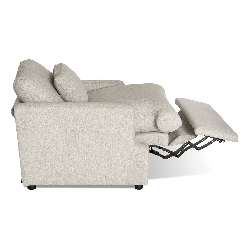 A side view of the My Cloud Power Recliner, featuring an extended footrest mechanism that highlights its reclining function. This cozy furniture piece offers thick cushions and a sleek, modern design.
