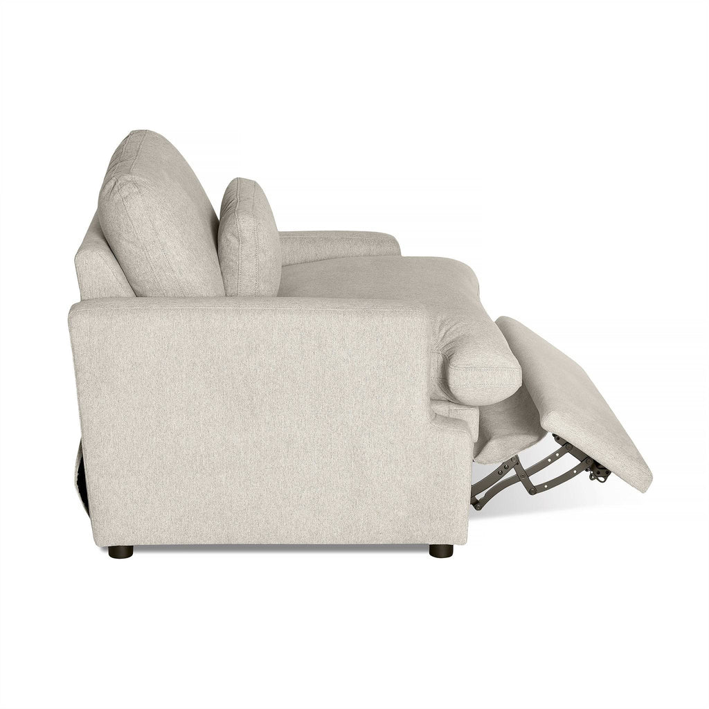 The My Cloud Power Recliner in light gray features a side view with an extended footrest. This customizable piece includes a cushioned back, armrests, and a subtly visible reclining mechanism beneath the seat for optimal comfort.
