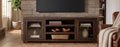 72 inch Homestead media console staged under a TV in a rustic living room