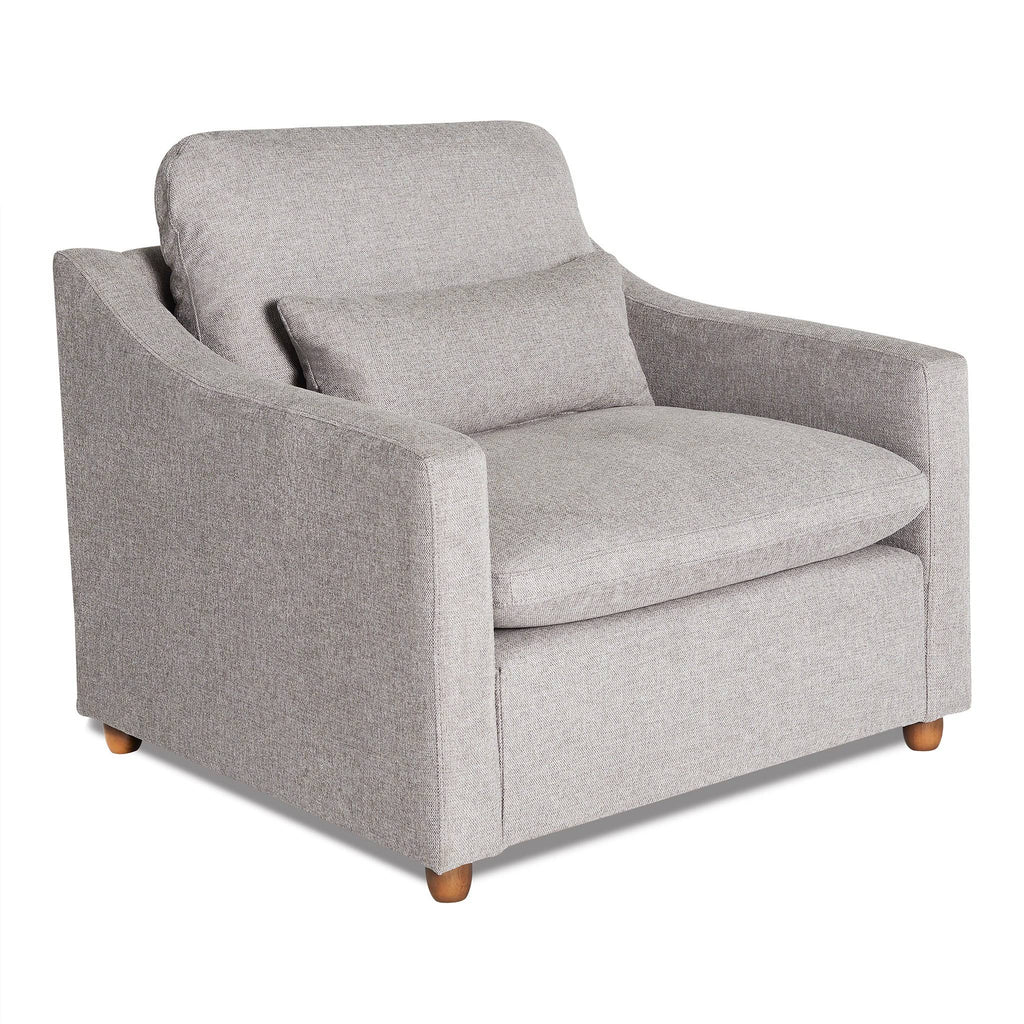 The My Cloud Slope Chair is a gray upholstered armchair featuring a cushioned seat and backrest, wooden legs, and a matching lumbar pillow. With slightly curved armrests, its modern design ensures style and relaxation for your living space.