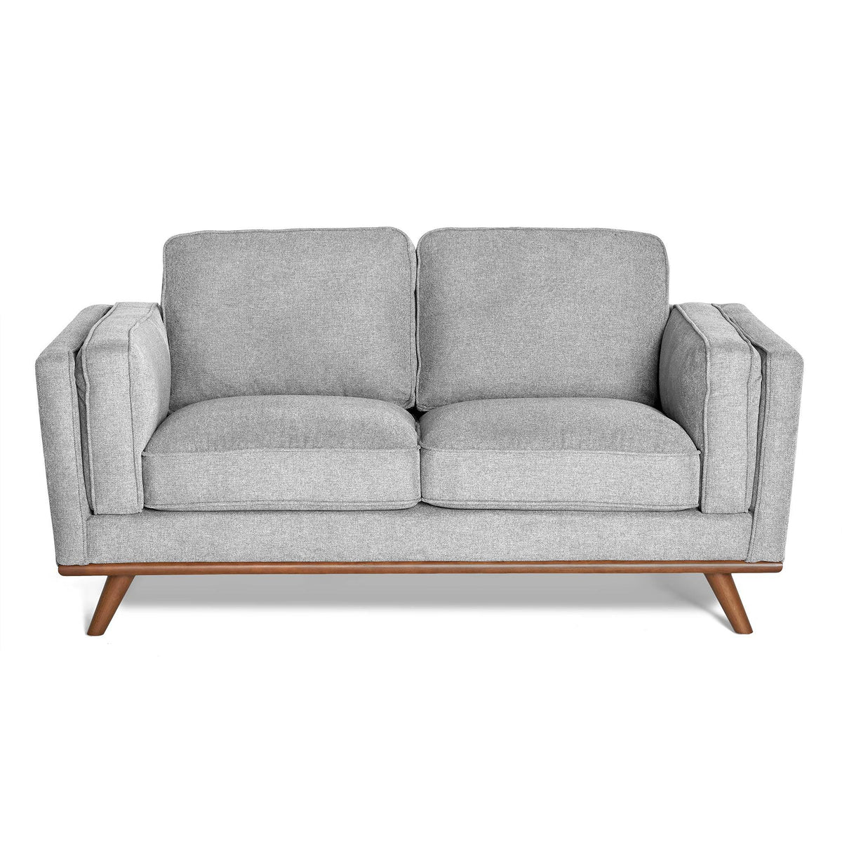 The Maddox Loveseat features light gray upholstery with plush cushions, a wooden base with angled legs, showcasing mid-century modern design. It boasts clean lines, minimalist aesthetics, and durable construction.