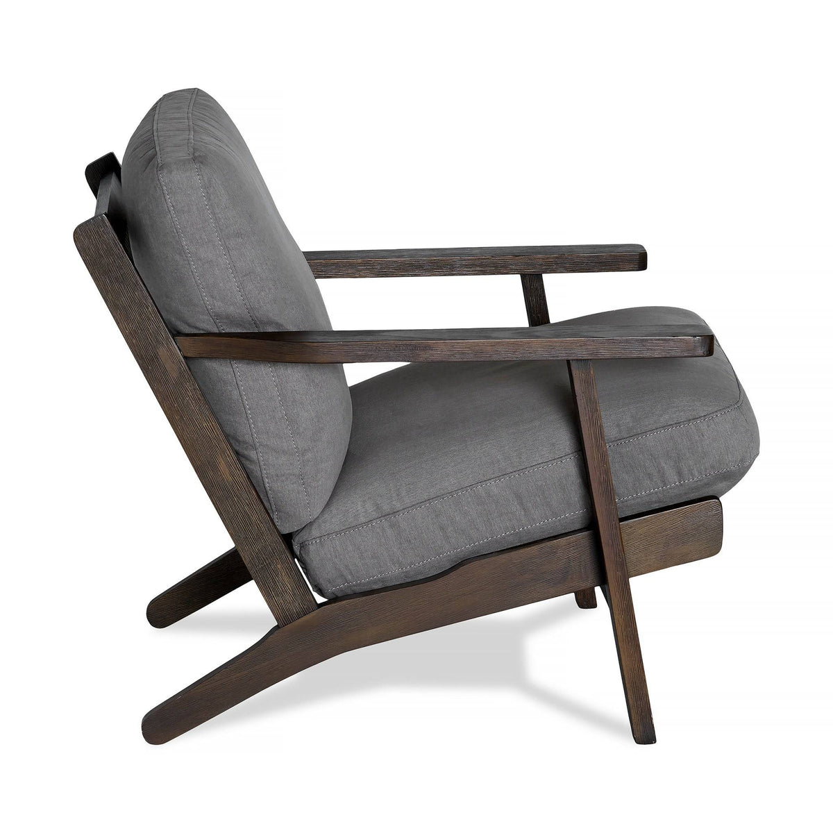 Side view of the Peyton Chair, featuring a stylish dark wooden frame and gray cushions. Its comfortable design includes an angled backrest and minimalist aesthetic, blending mid-century and contemporary styles seamlessly.