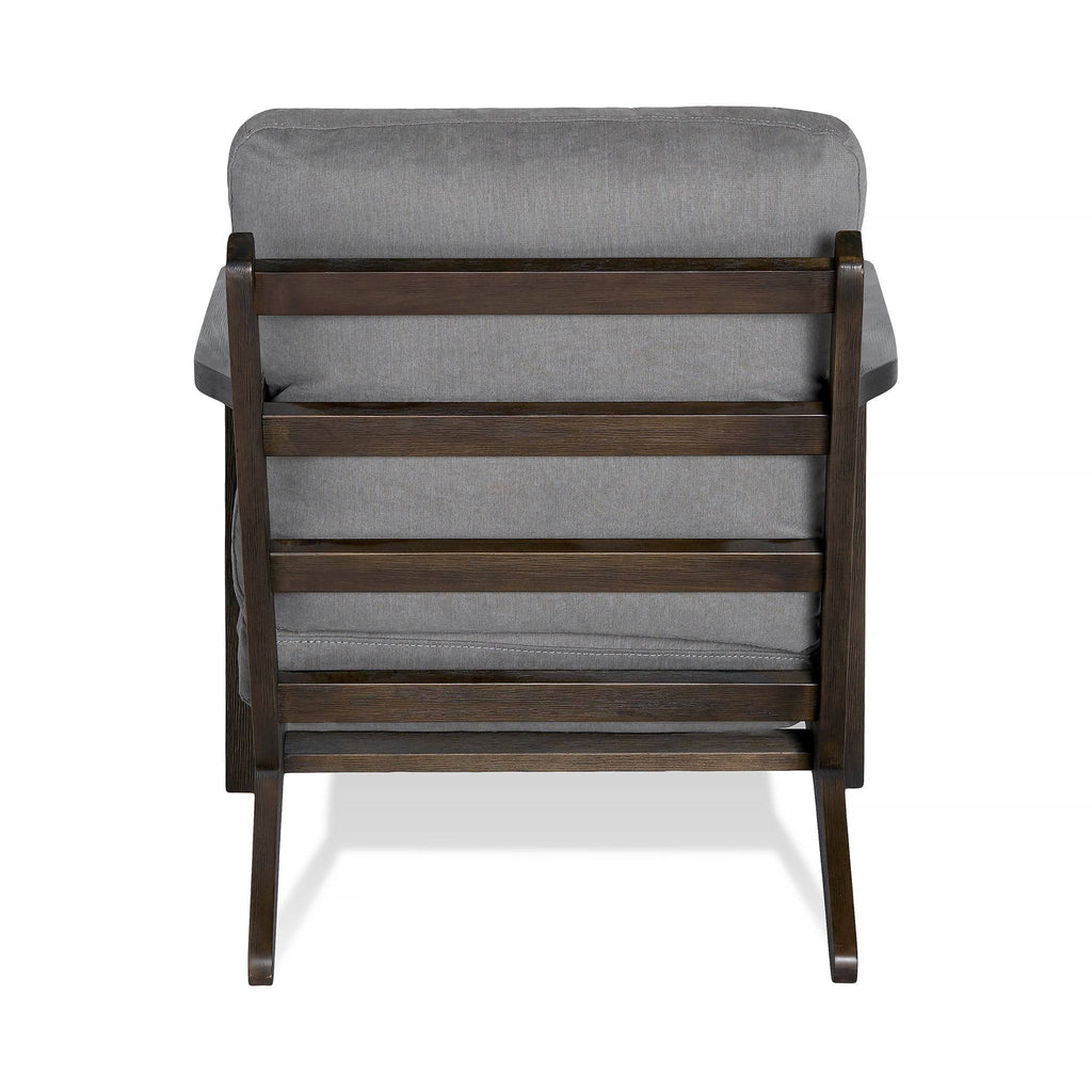 The Peyton Chair showcases a sleek rear view with dark brown slats and a cushioned backrest and seat upholstered in gray fabric. This mid-century style piece features a minimalist design with clean lines and a sturdy frame, perfectly blending elegance and comfort.