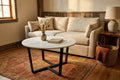 Marble Top coffee table staged in a warm rustic living room