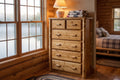 Northwoods 6 drawer log chest staged in a lakeside guest bedroom