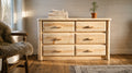 Wilderness pale pine 6 drawer dresser in a bright Scandinavian-style guest bedroom