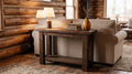 Barnwood Sofa Table staged behind a sofa in a warm cabin living room
