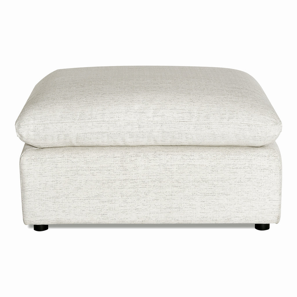 The My Cloud Slope Armless ottoman features a square, cushioned design with a light beige fabric cover and short dark legs. Its modern simplicity makes it an inviting addition to any seating arrangement, perfect for enhancing your living room decor.
