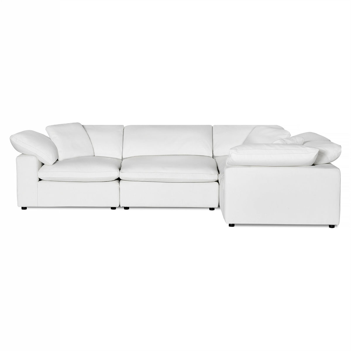 The Peyton is a white sectional sofa featuring plush cushions and a minimalist design. Its connected segments offer modern comfort and a clean look, blending seamlessly into contemporary living spaces with versatile appeal.