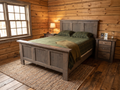Majestic Pines Itasca Bed in weathered gray, staged in a Minnesota log cabin bedroom