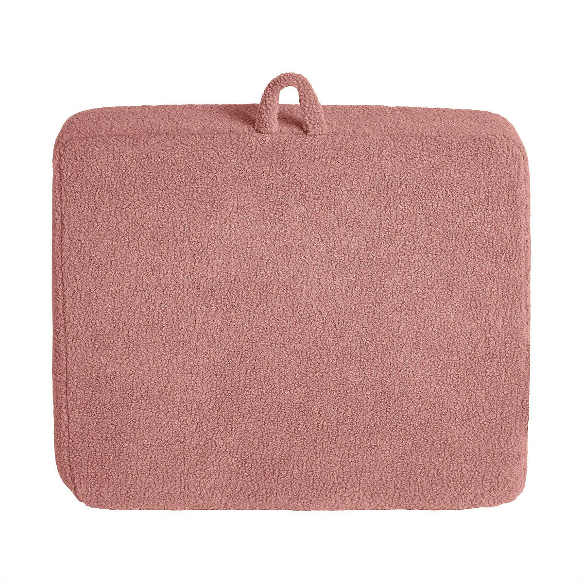 A soft pink rectangular bath mat with a plush Sherpa fabric surface and a small fabric loop enhances modern minimalism, pairing stylishly with the customizable My Cloud Kidz Chair.