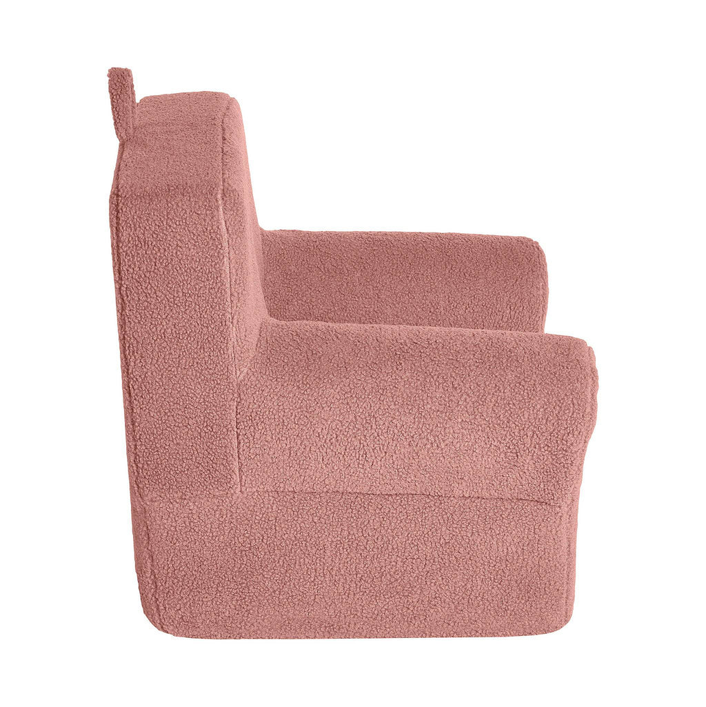 Side view of the My Cloud Kidz Chair, a plush childrens chair in pink with a high back and armrests. Made from cozy sherpa fabric, it provides teddy-bear-like comfort and is ideally sized for children.