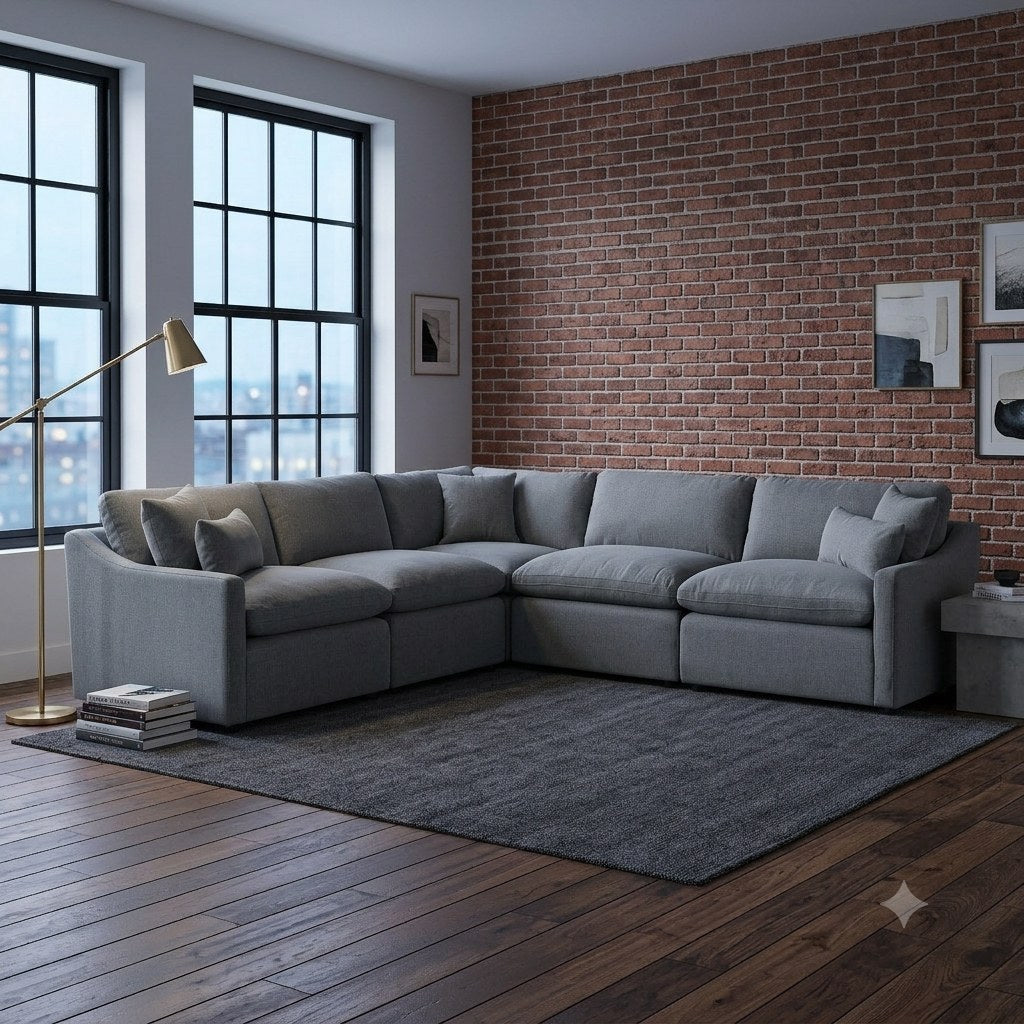 My Cloud Slope sectional in Classic Gray staged in a modern brick loft