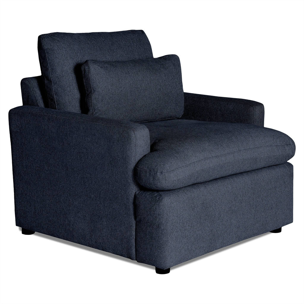 The My Cloud Chair is a dark gray cushioned armchair featuring a wide seat, padded armrests, and a matching back cushion. This comfortable furniture piece has a soft upholstered texture and rests on small black feet.