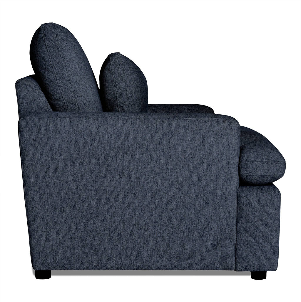 Side view of a dark blue My Cloud Chair against a white backdrop. This cushioned seating features two large back cushions and one left armrest, supported by small black legs. A blend of style and adaptability makes this customizable furniture perfect for any space.